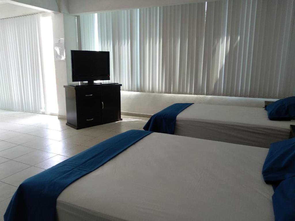 Letto o letti in una camera di Posada San Cristobal