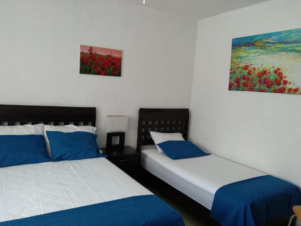 Letto o letti in una camera di Posada San Cristobal