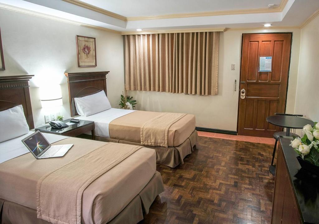 Postel nebo postele na pokoji v ubytování Fersal Hotel - P. Tuazon Cubao