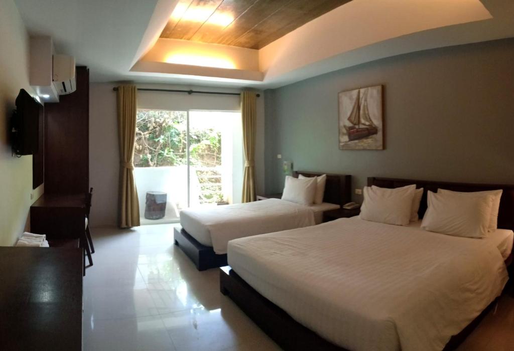 Postel nebo postele na pokoji v ubytování Aonang Eco Inn Krabi