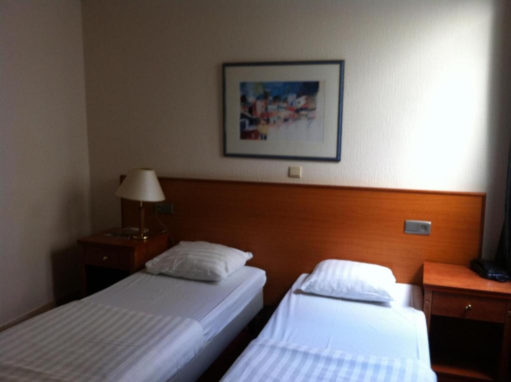 Postel nebo postele na pokoji v ubytování Delta Hotel City Center