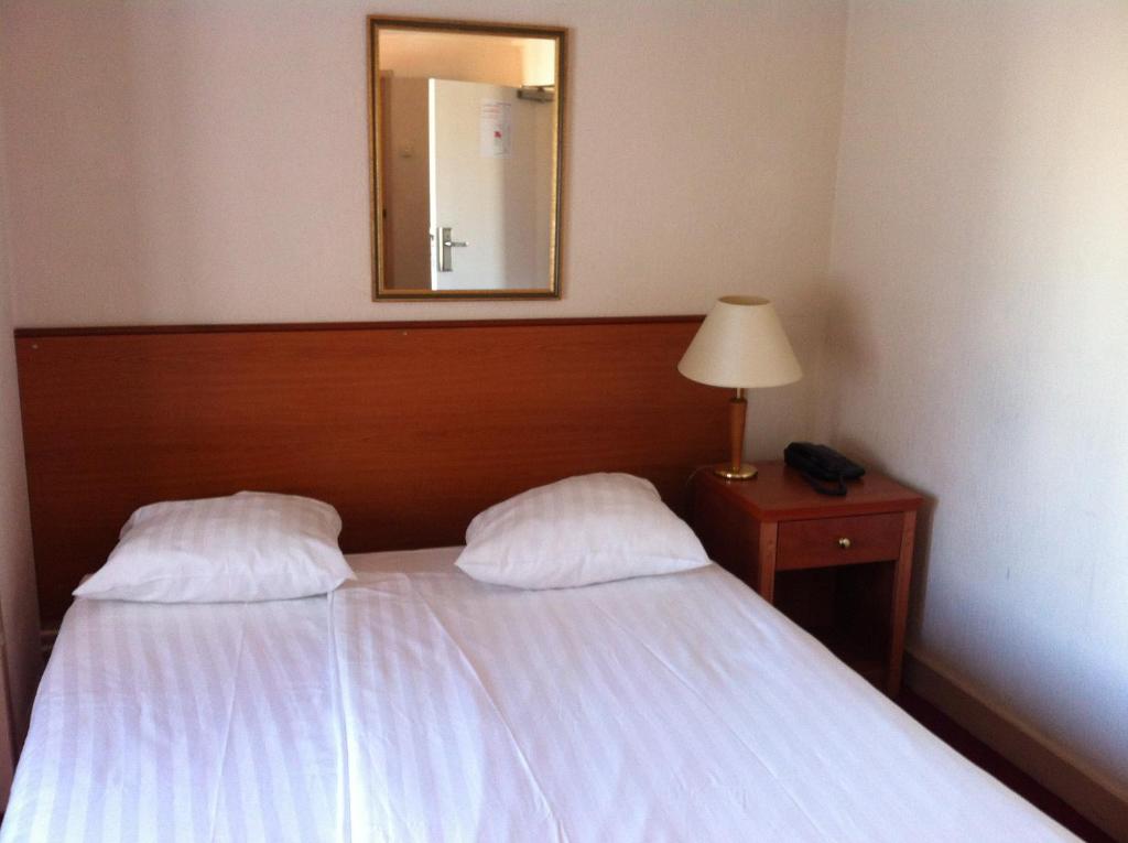 Postel nebo postele na pokoji v ubytování Delta Hotel City Center