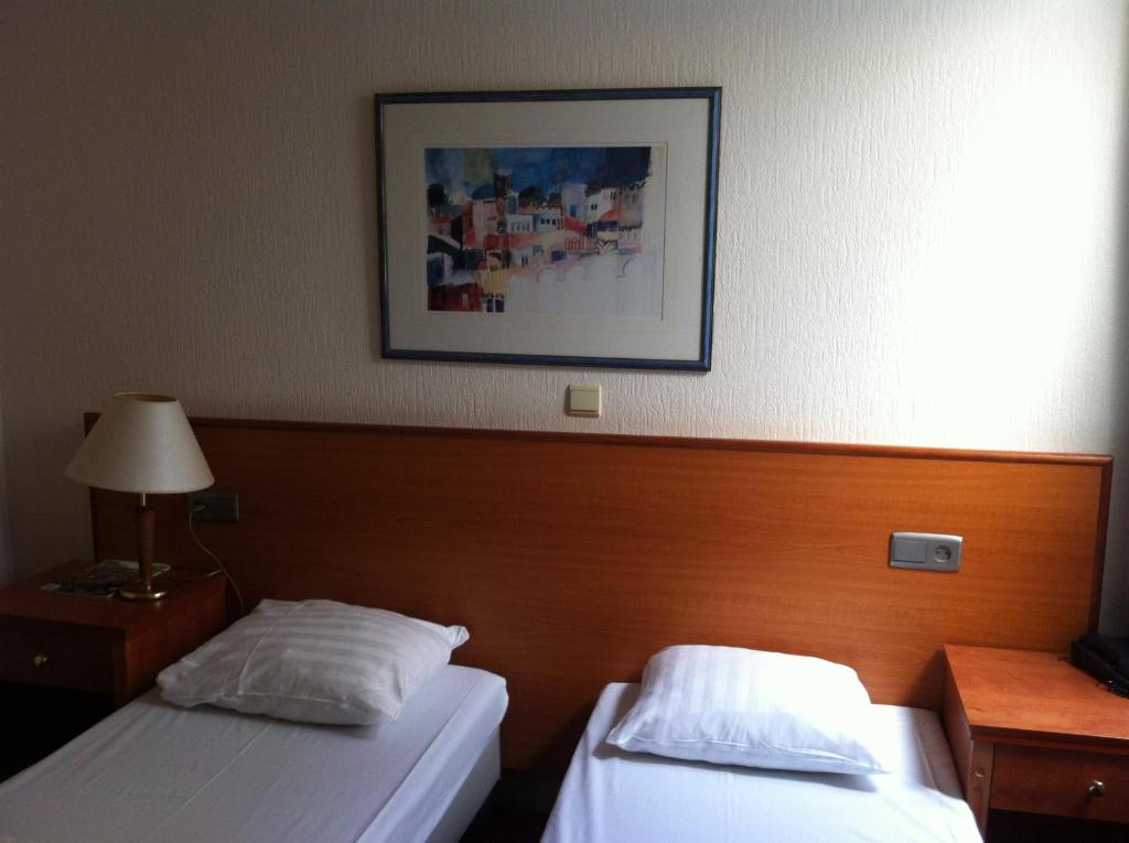 Postel nebo postele na pokoji v ubytování Delta Hotel City Center