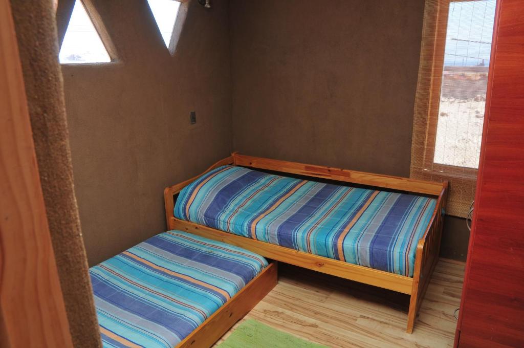 Postel nebo postele na pokoji v ubytování Hospedaje Boutique Ckamur