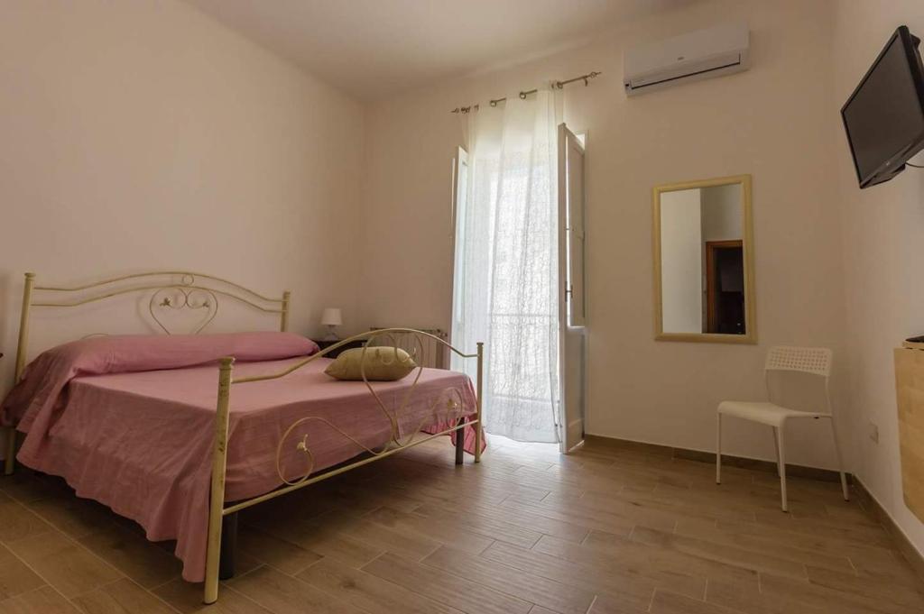 Postel nebo postele na pokoji v ubytování Affittacamere Raggio di sole