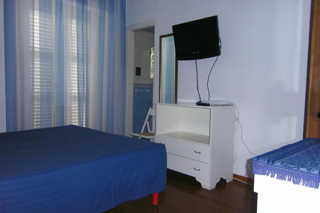 A bed or beds in a room at Hotel Galassi