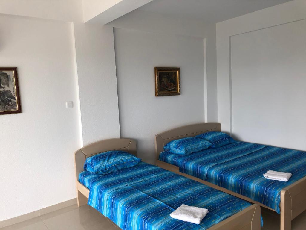 Postel nebo postele na pokoji v ubytování Apartmani Maja