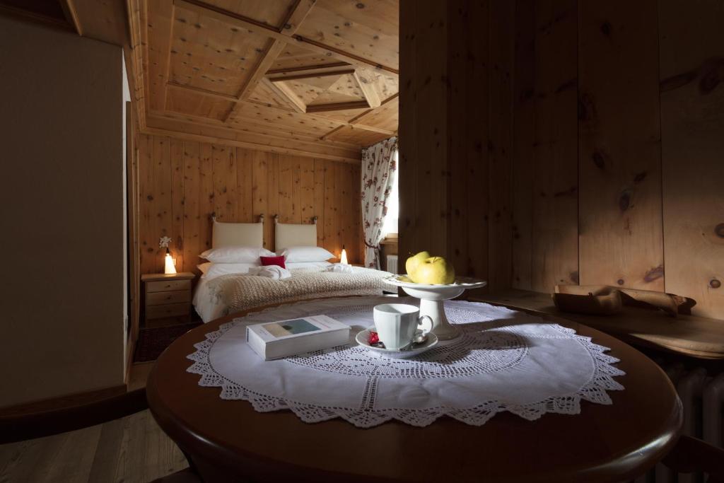 Postel nebo postele na pokoji v ubytování Hotel Baita Fiorita