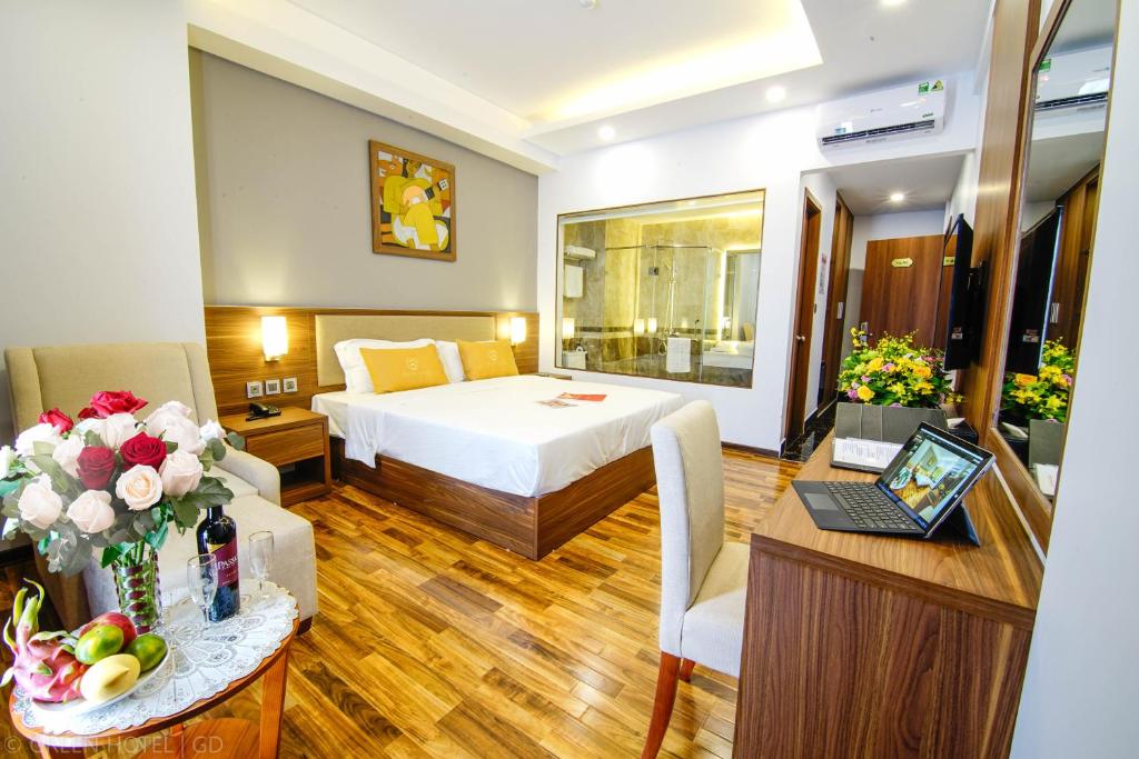 Postel nebo postele na pokoji v ubytování Green Hadong Hotel