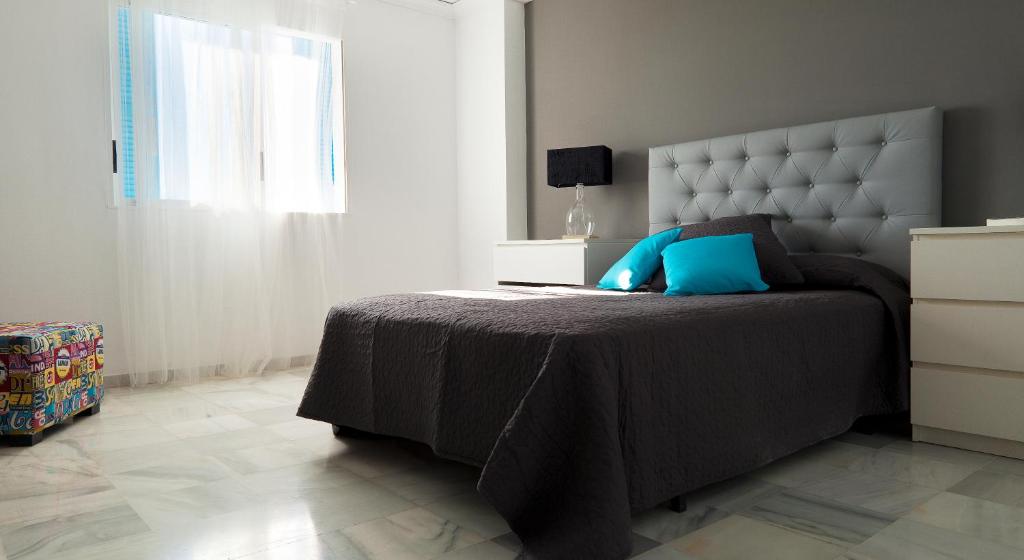 Postel nebo postele na pokoji v ubytování Apartamentos Alberca - Deniasol