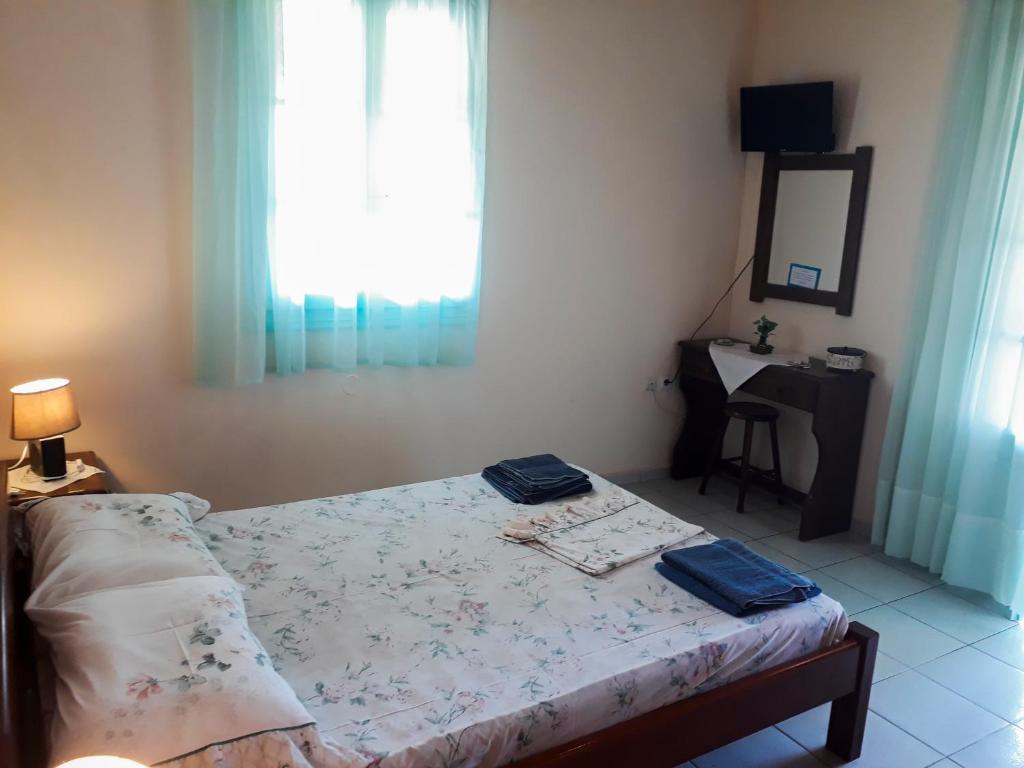 Postel nebo postele na pokoji v ubytování Galaxy Rooms