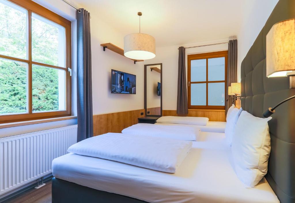 Postel nebo postele na pokoji v ubytování Kitz Residenz by Alpin Rentals - incl Summercard