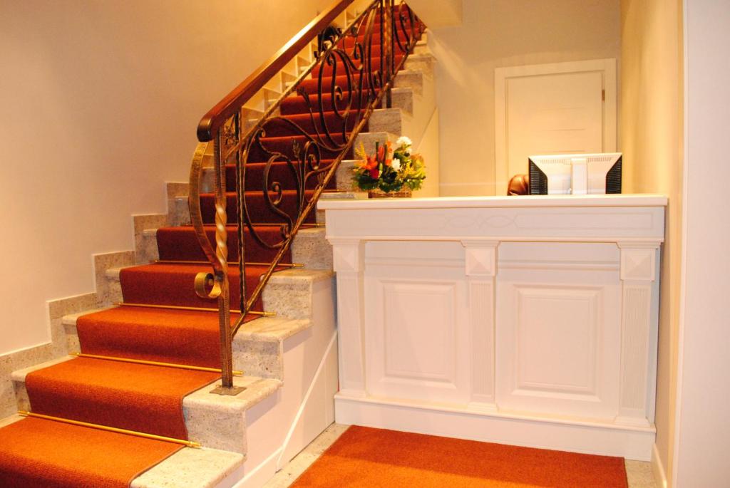 a staircase in a home with a stair case at Hotel Vila 60 in Tirana