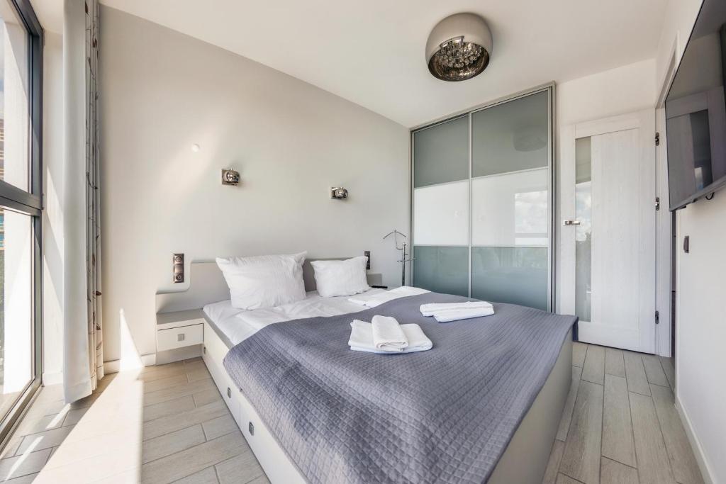 Posteľ alebo postele v izbe v ubytovaní Apartamenty Sun & Snow Horyzont