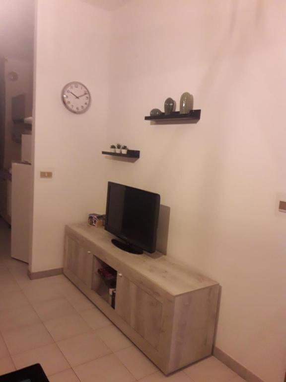 TV a/nebo společenská místnost v ubytování B&B L'ARANCIO