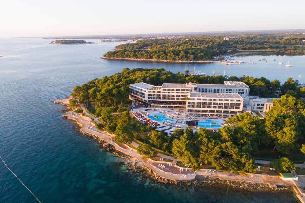 an aerial view of a resort on the water at Hotel Parentium Plava Laguna in Poreč