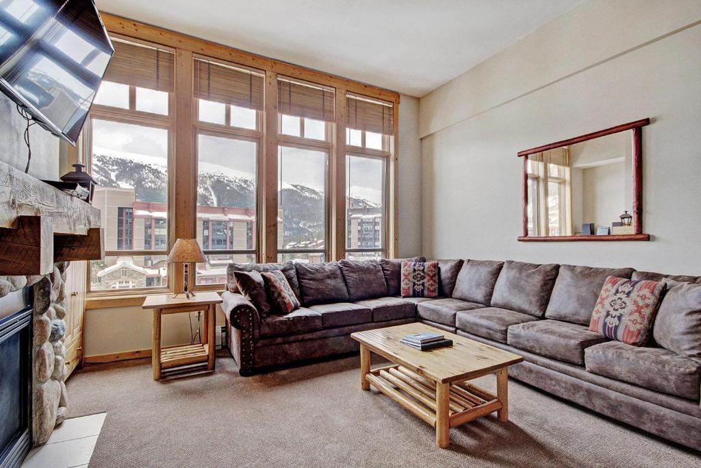 a living room with a couch and a table at Tx304 Taylors Crossing Condo in Copper Mountain