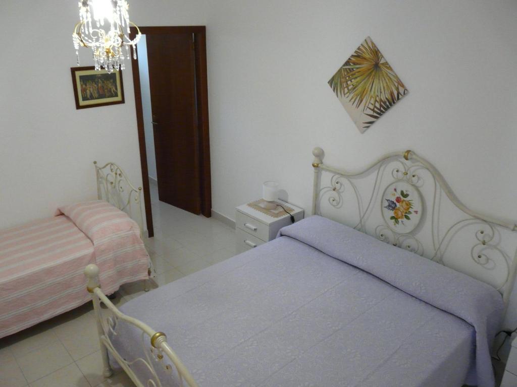 Postel nebo postele na pokoji v ubytování Villa Yucca