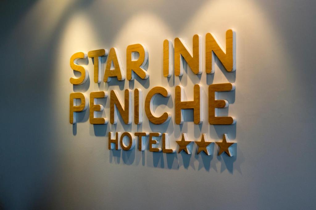 a sign that reads star inn perth hotel at Star inn Peniche in Peniche