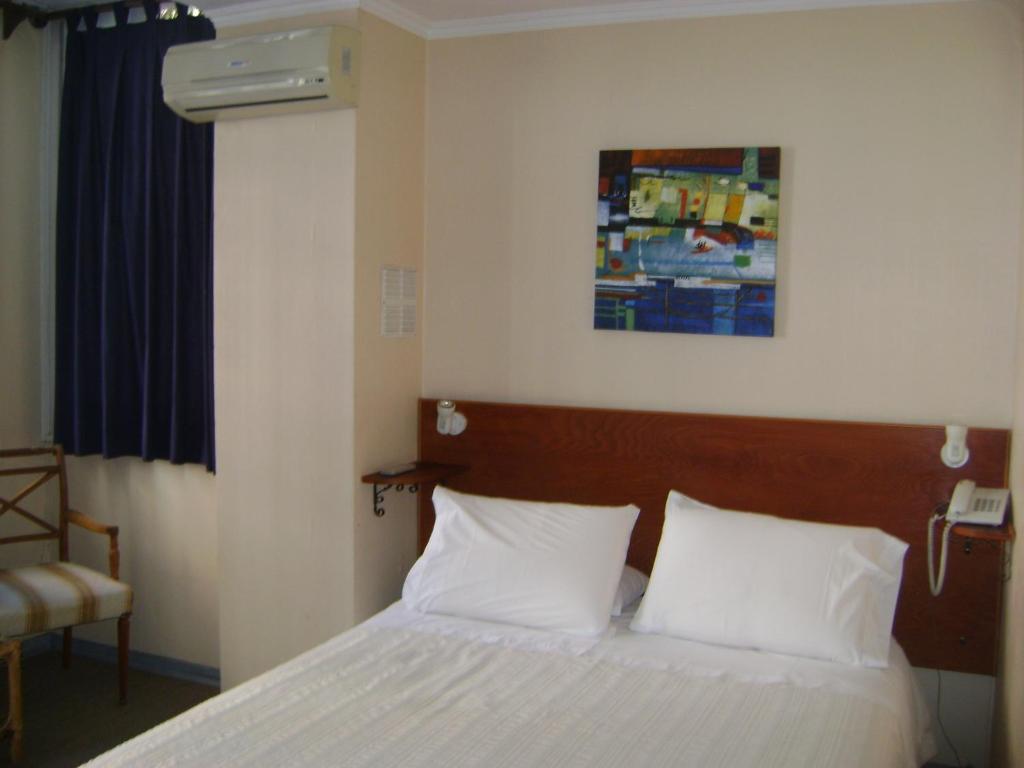 Postel nebo postele na pokoji v ubytování Chilhotel en Providencia