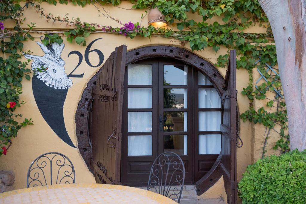 a door to a building with a window at Pikes Ibiza in San Antonio