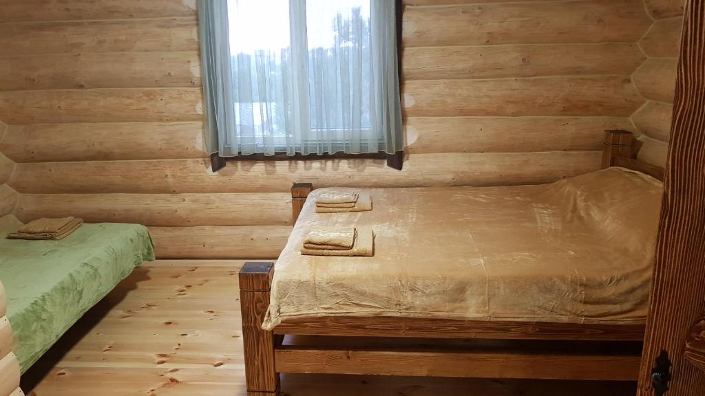 Postel nebo postele na pokoji v ubytování Эко-хаус