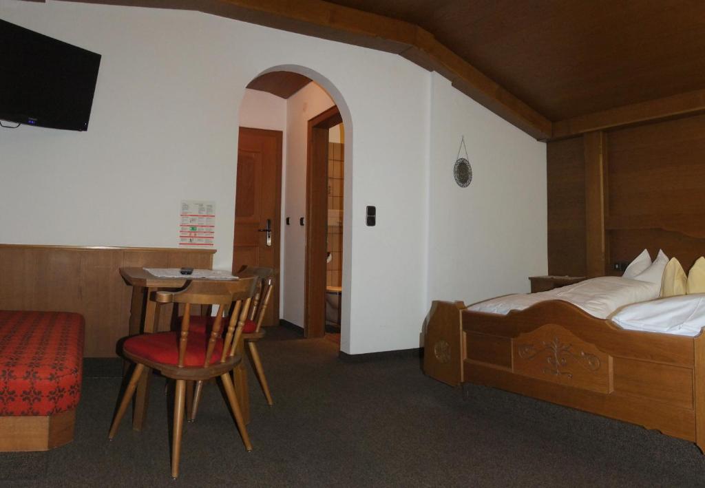 Posteľ alebo postele v izbe v ubytovaní Hotel Garni Obermair