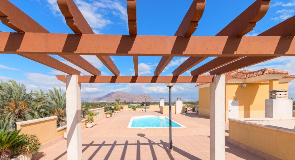 Bazén v ubytovaní Residential jardín del pintor - la casa amarilla alebo v jeho blízkosti