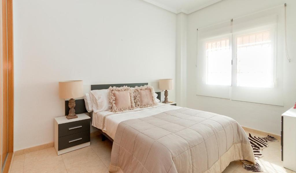 Posteľ alebo postele v izbe v ubytovaní Residential jardín del pintor - la casa amarilla