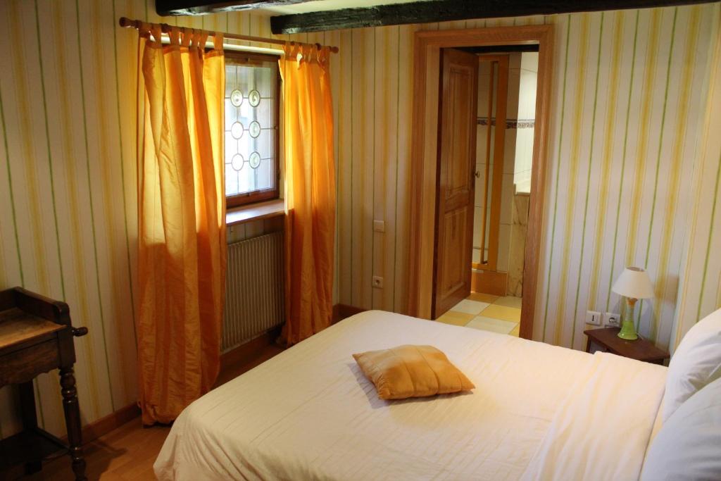 Postel nebo postele na pokoji v ubytování B&B La Tête dans les Etoiles