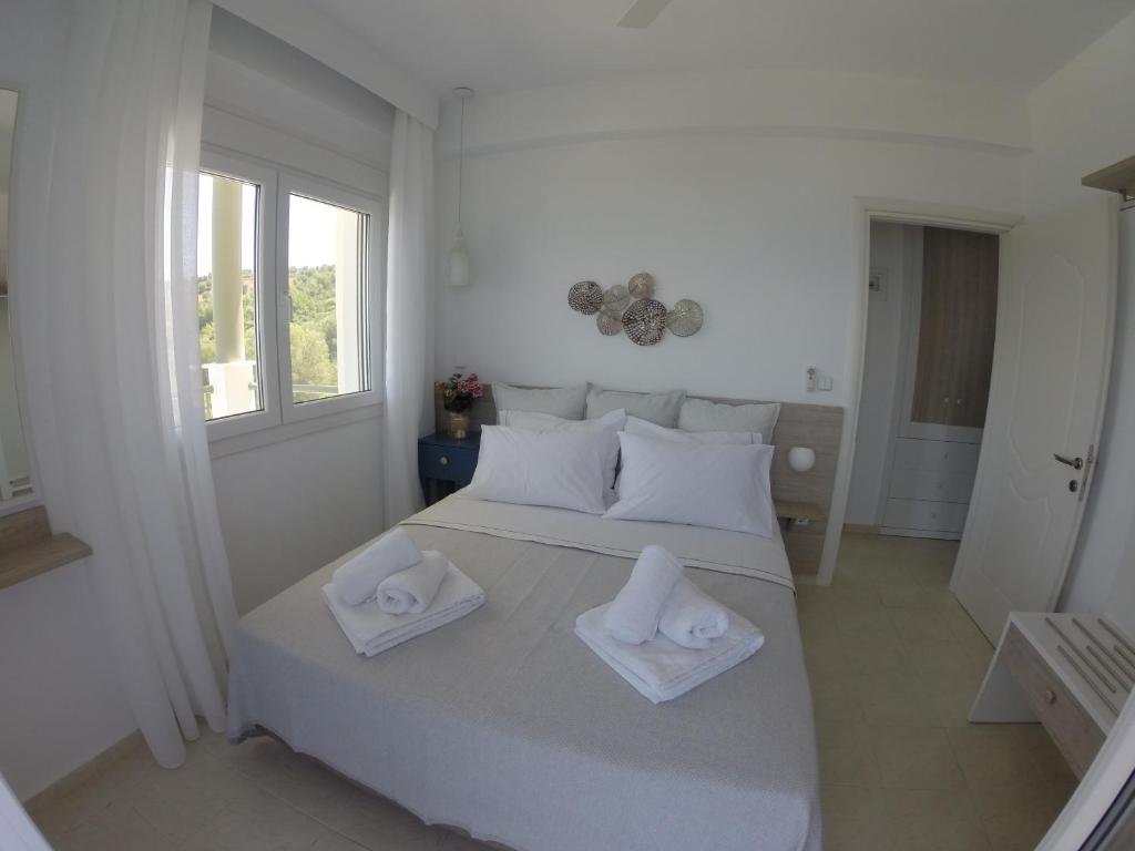 Postel nebo postele na pokoji v ubytování Paliouri Sea Lounge by Luxlikehome