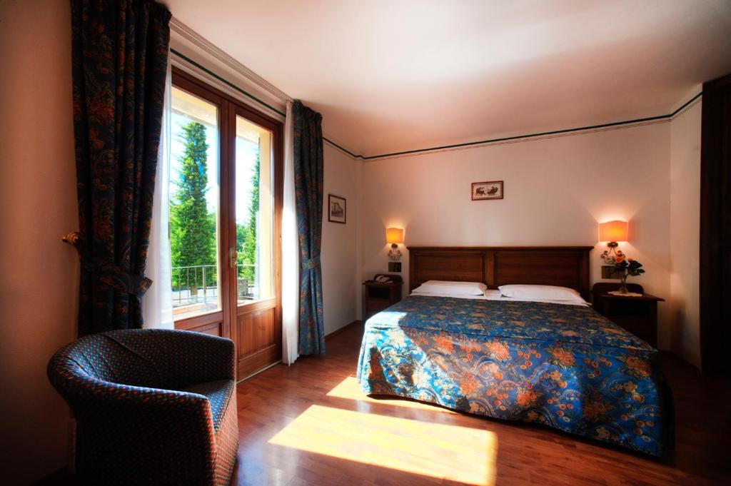 Postel nebo postele na pokoji v ubytování Albergo La Lanterna