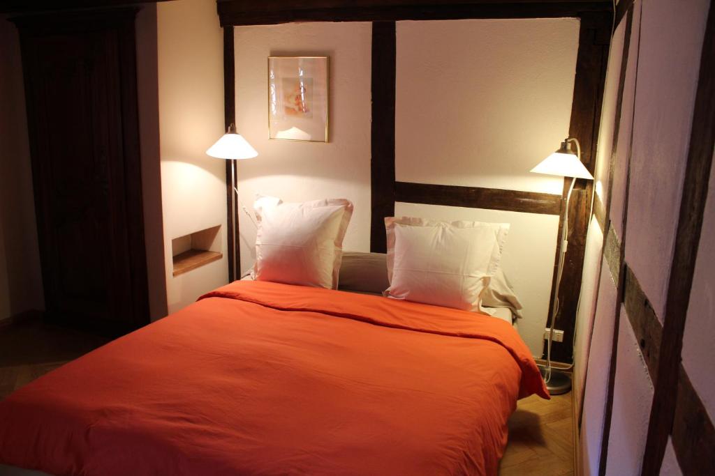 Postel nebo postele na pokoji v ubytování B&B La Tête dans les Etoiles