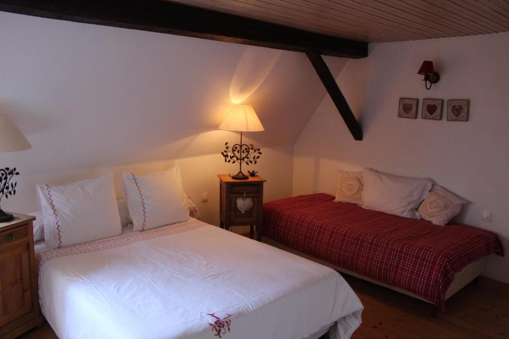 Postel nebo postele na pokoji v ubytování B&B La Tête dans les Etoiles