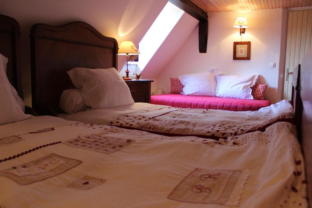 Postel nebo postele na pokoji v ubytování B&B La Tête dans les Etoiles