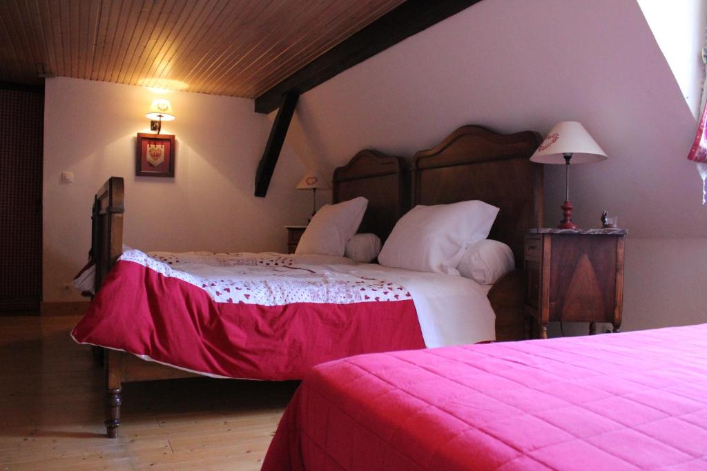 Postel nebo postele na pokoji v ubytování B&B La Tête dans les Etoiles