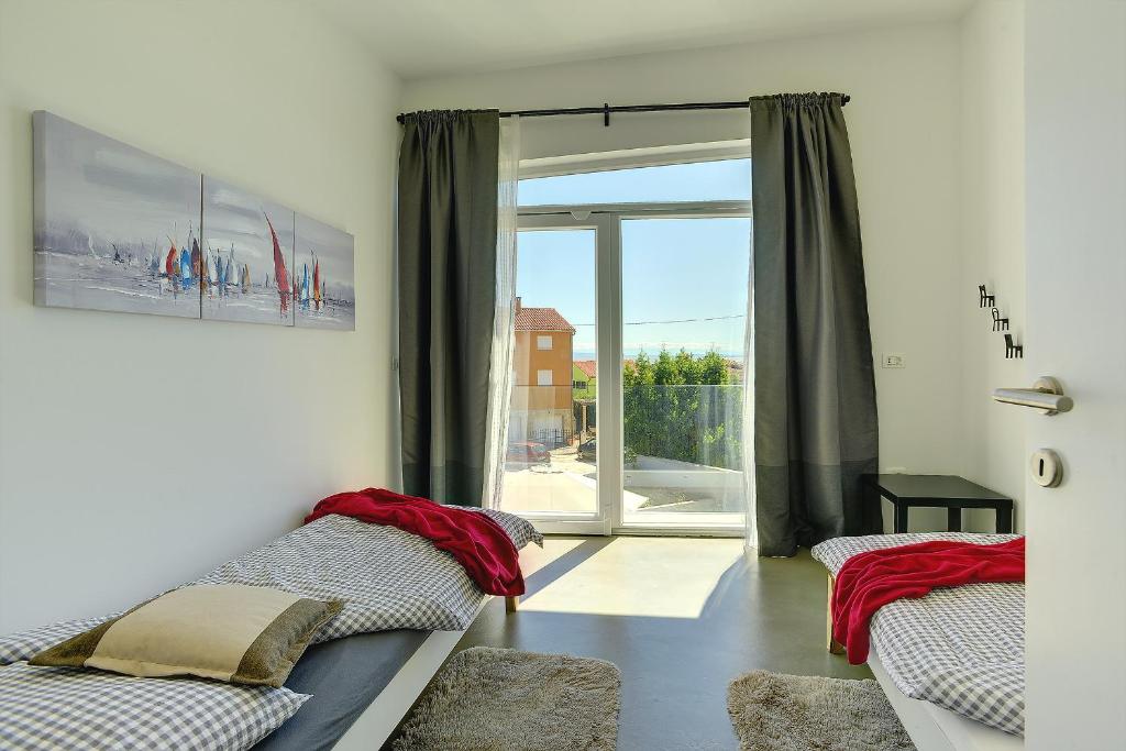 Posteľ alebo postele v izbe v ubytovaní Villa Yania