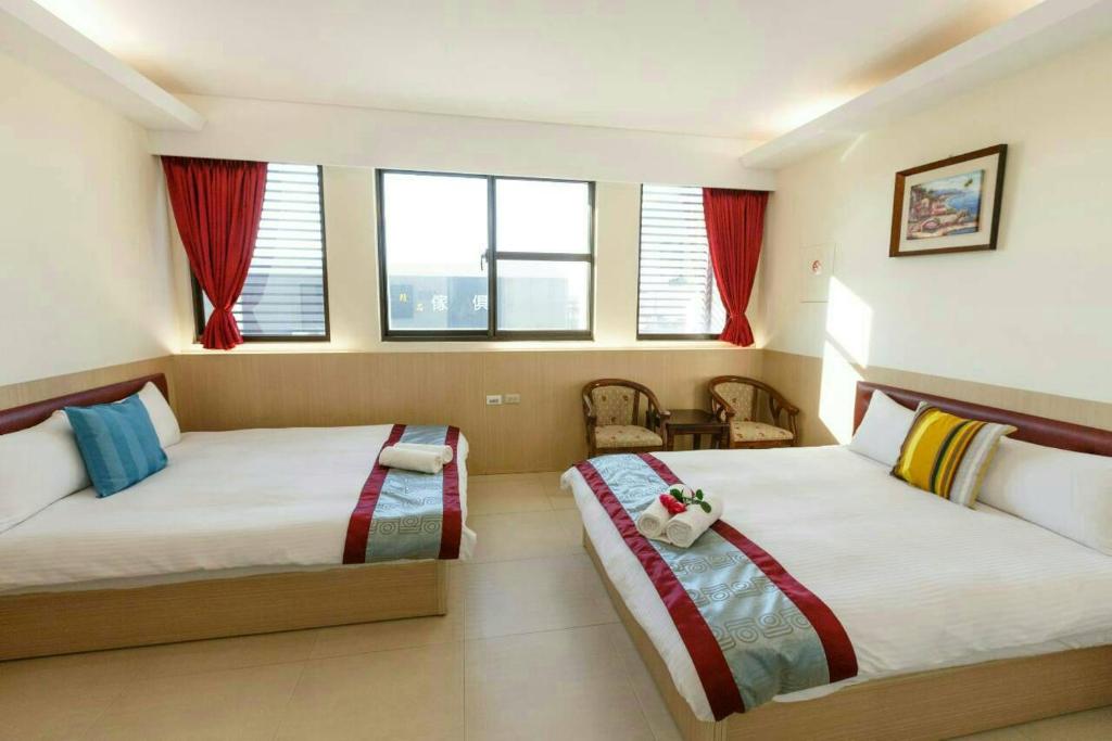 Postel nebo postele na pokoji v ubytování Kenting Mulan Homestay