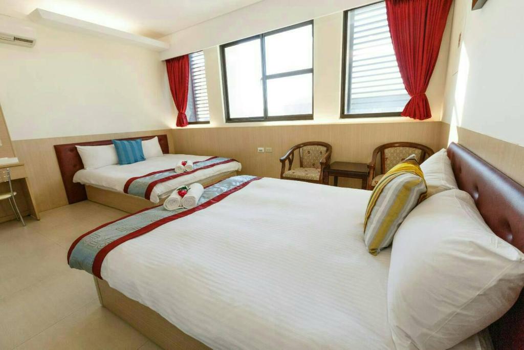 Postel nebo postele na pokoji v ubytování Kenting Mulan Homestay