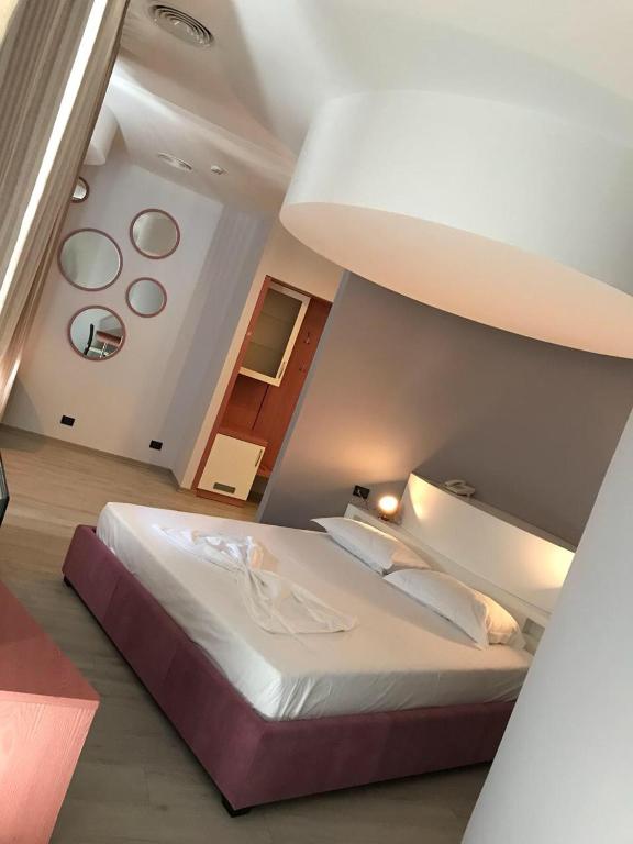 Postel nebo postele na pokoji v ubytování Icon Hotel