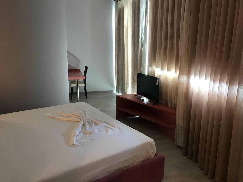 Postel nebo postele na pokoji v ubytování Icon Hotel