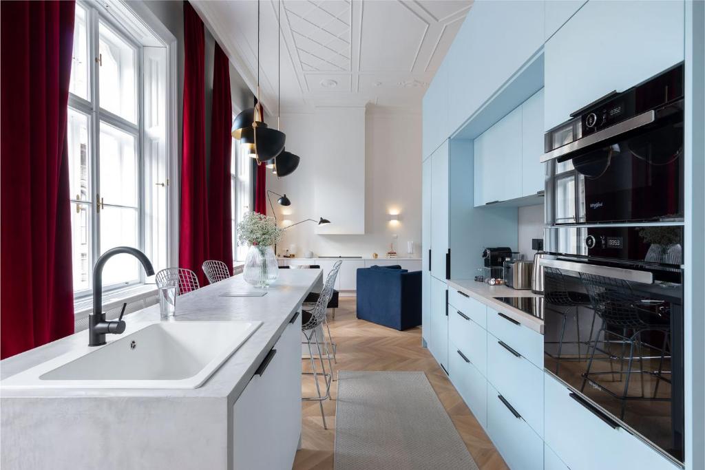 a kitchen with a sink and a counter top at Erkel Boutique Apartment–Chic flat by Market Hall in Budapest