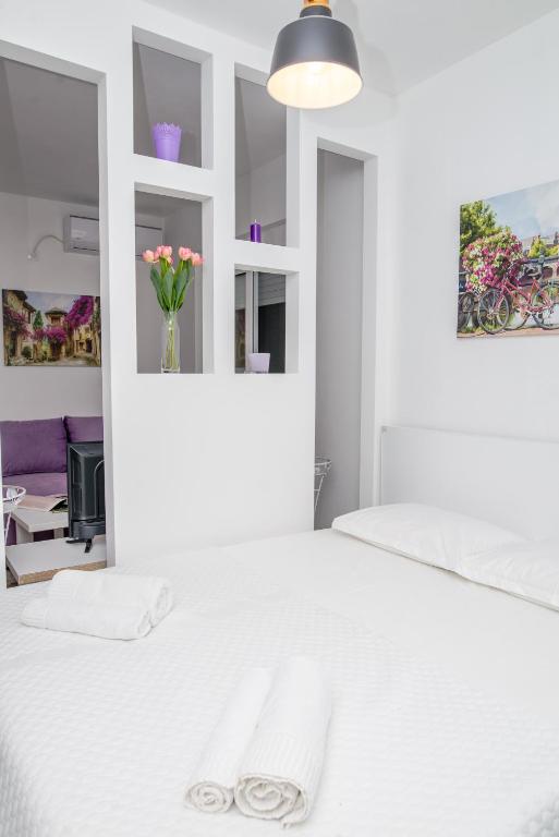 Postel nebo postele na pokoji v ubytování Apartments Tina