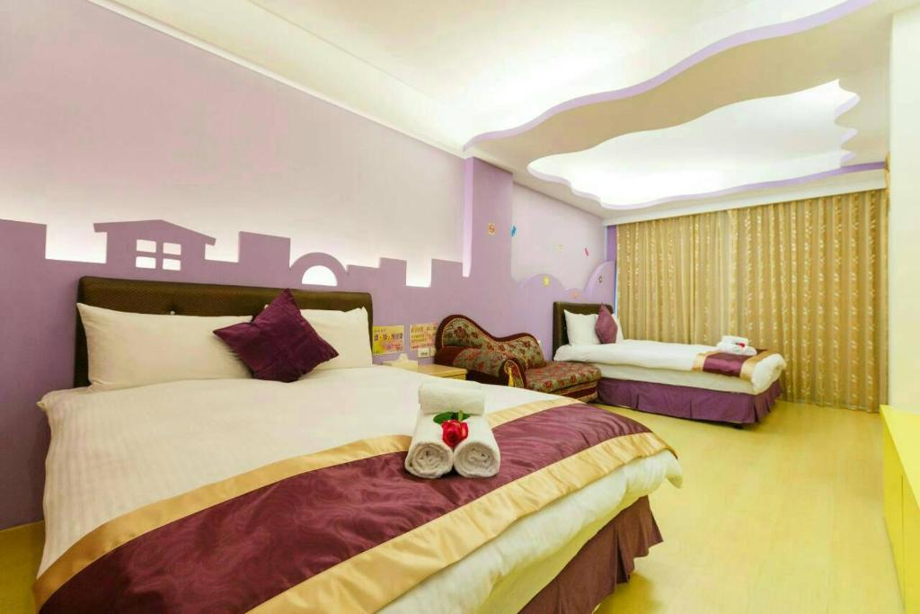 Postel nebo postele na pokoji v ubytování Kenting Mulan Homestay