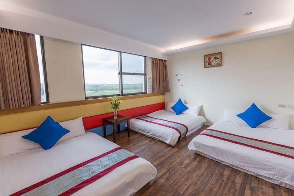 Postel nebo postele na pokoji v ubytování Kenting Mulan Homestay