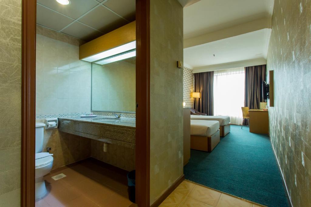 Postel nebo postele na pokoji v ubytování New York Hotel