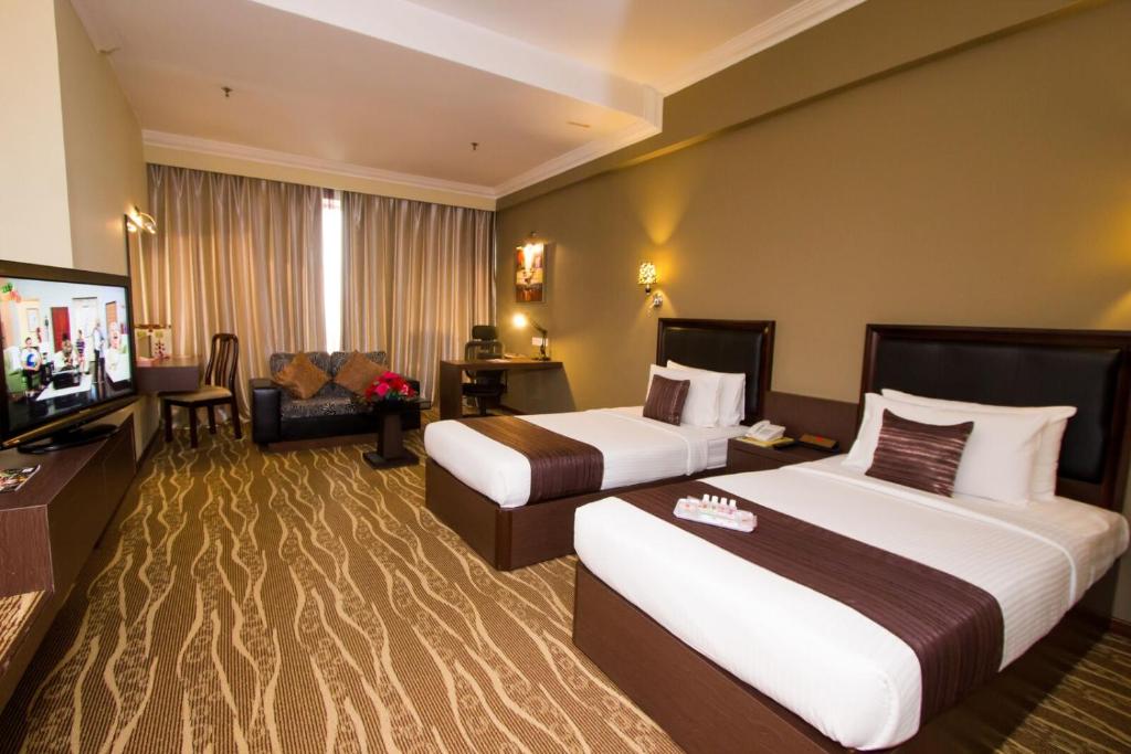 Postel nebo postele na pokoji v ubytování New York Hotel