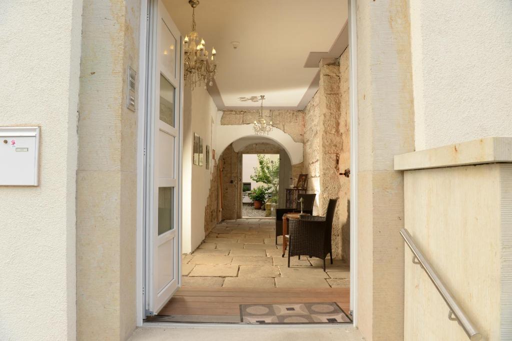 an open doorway to a hallway in a house at Hortensiensuite in Pirna