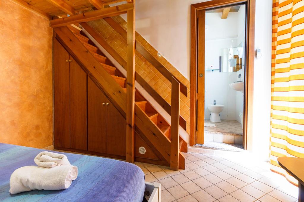 Postel nebo postele na pokoji v ubytování Agriturismo Il Gelsomino Ritrovato