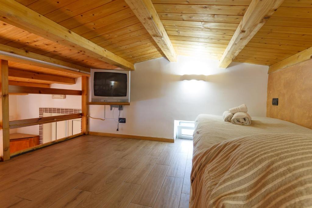 Postel nebo postele na pokoji v ubytování Agriturismo Il Gelsomino Ritrovato